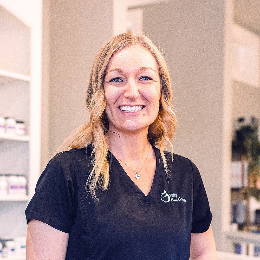 Smiling professional in a clinic setting.