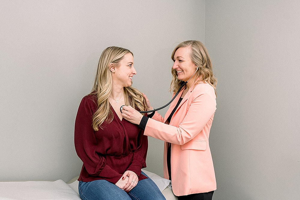 Doctor consulting with patient in office setting.
