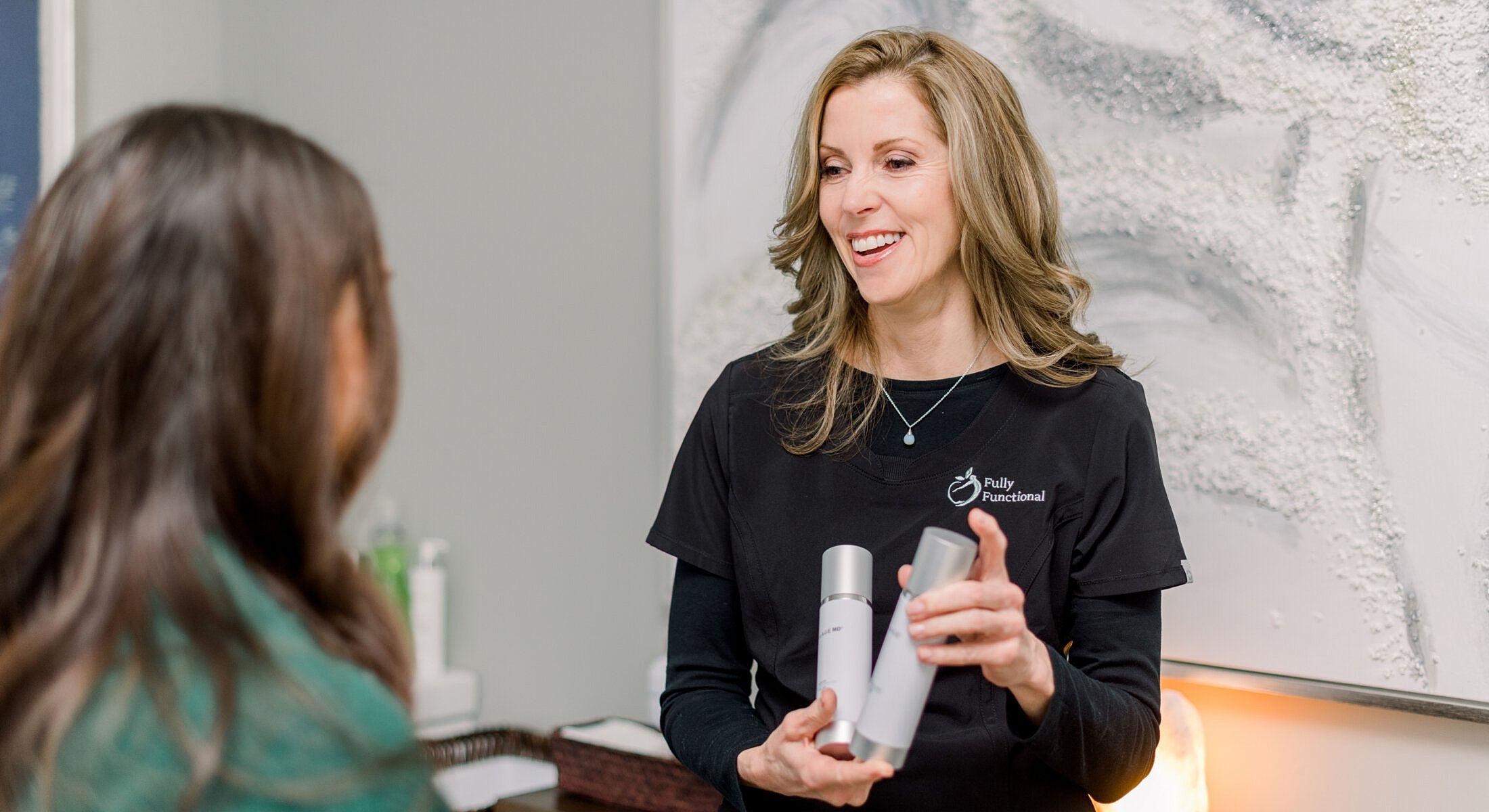 Woman discussing skincare products with a client