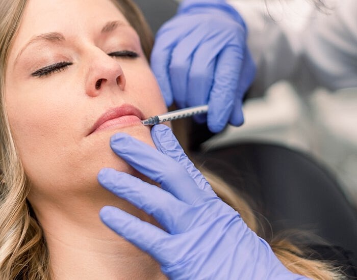 Cosmetic procedure involving lip injections.