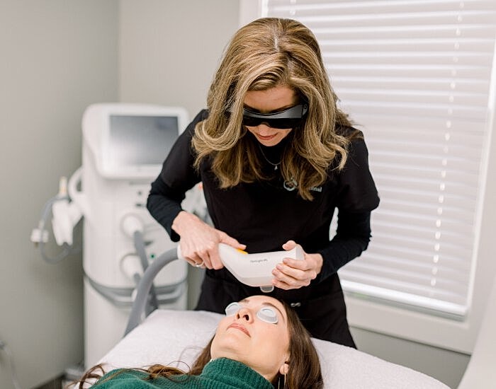 Laser treatment session in a clinical setting.