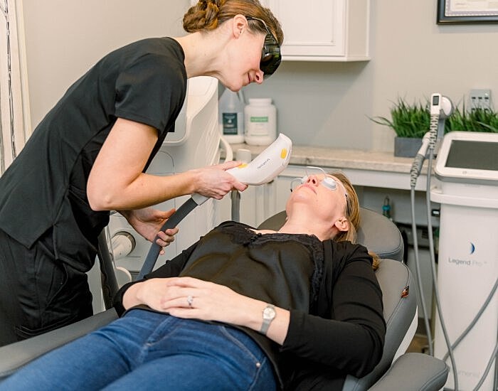 Laser treatment session in a clinical setting.