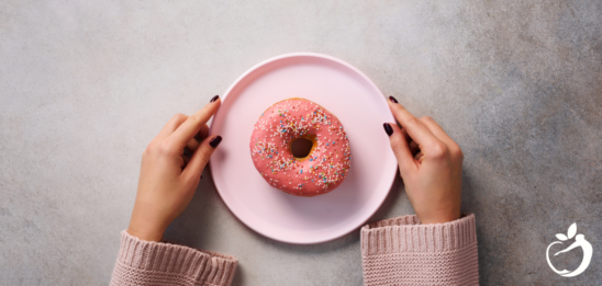 Blog Post Header Image - All About Blood Sugar + Natural Remedies for High Blood Sugar. Image of a donut on a plate.