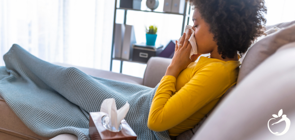 woman sick on the couch