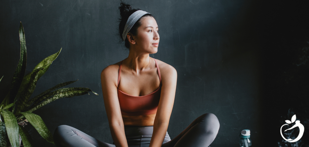 woman wearing athletic clothing doing yoga