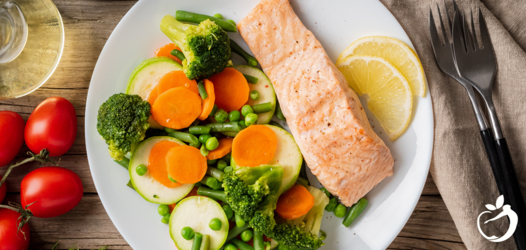 salmon, eggs, and vegetables on a plate