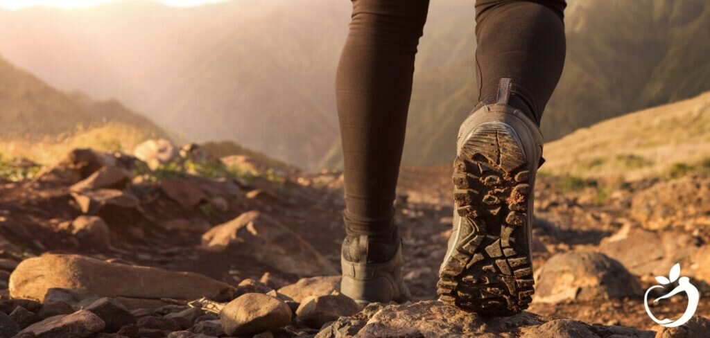 man trail running on a mountain