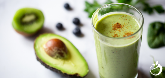 Blog Post Header Image - Detox Smoothie Guide - Image of green smoothie with cinnamon sprinkled on top.