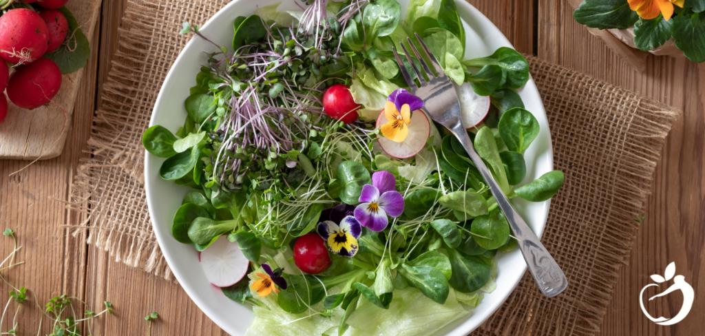 a mixed salad in a white bowl