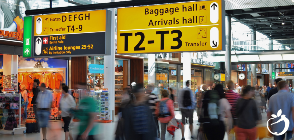 people walking around in an airport