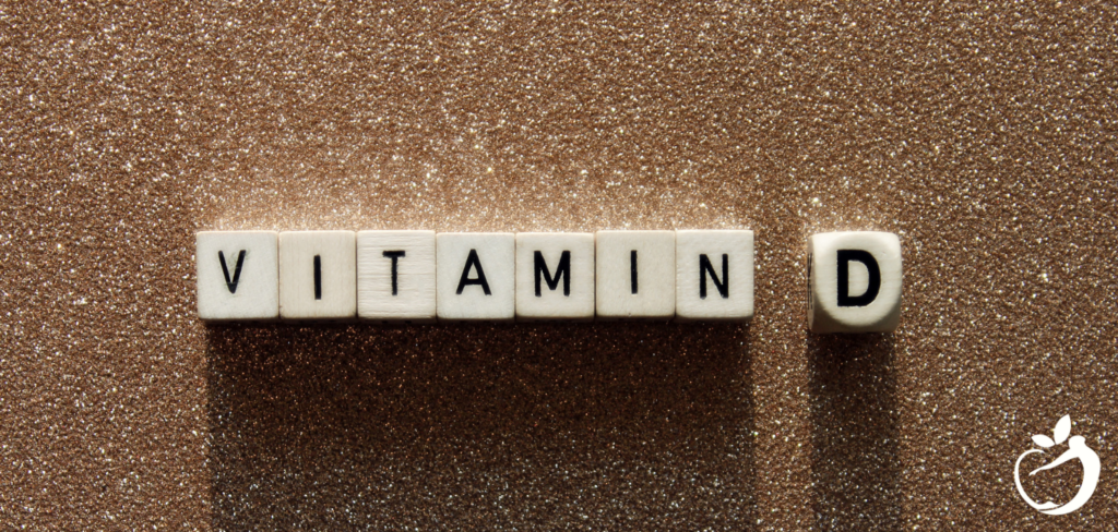 Blog Post Header Image - Health Benefits of Vitamin D. Image of scrabble pieces spelling out: "Vitamin D"