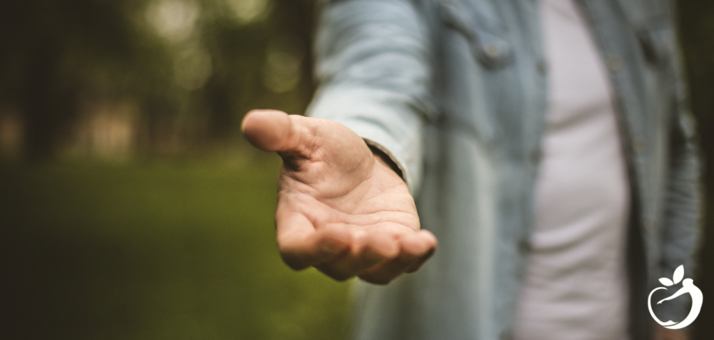 Person reaching their hand out