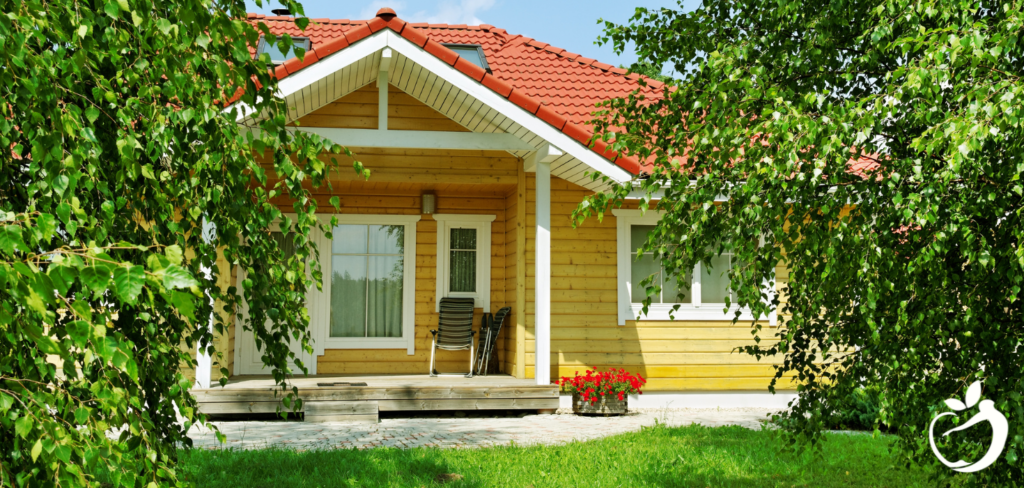 a bright yellow home on a sunny day