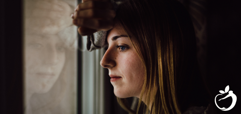 woman looking out of a window