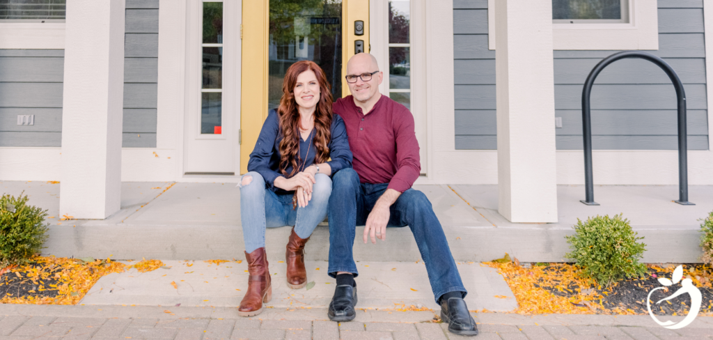 Dr. Scott and Dr. Ellen Antoine sitting on the steps of the Center for Fully Functional® Health