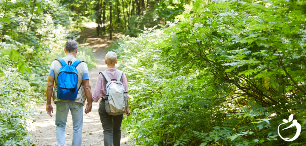 two people hiking in the woods together