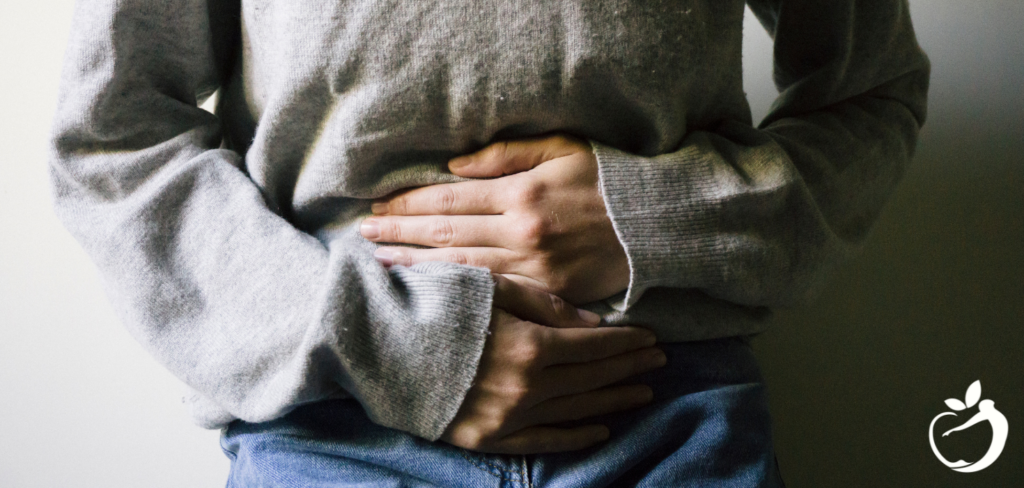 woman holding her stomach