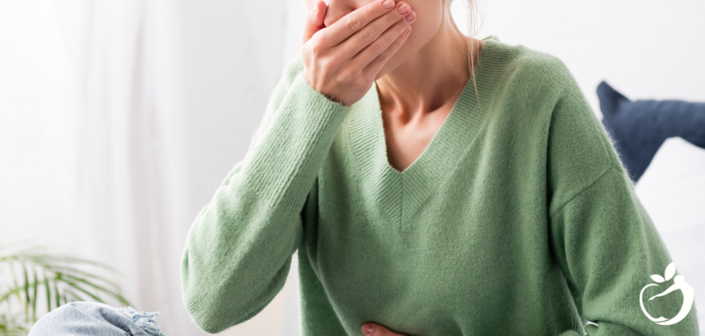 woman holding her hand over her mouth