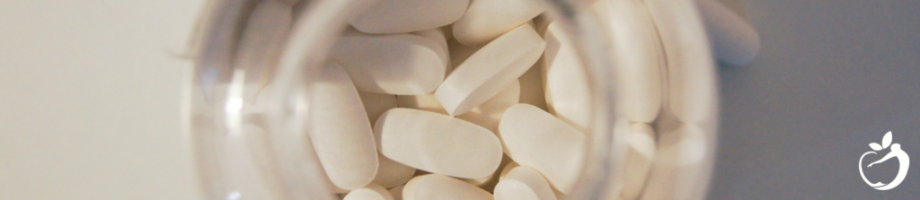 To show an image of big white pills that look like antibiotics.