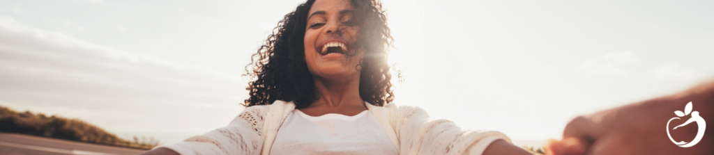 woman laughing out in the sunshine