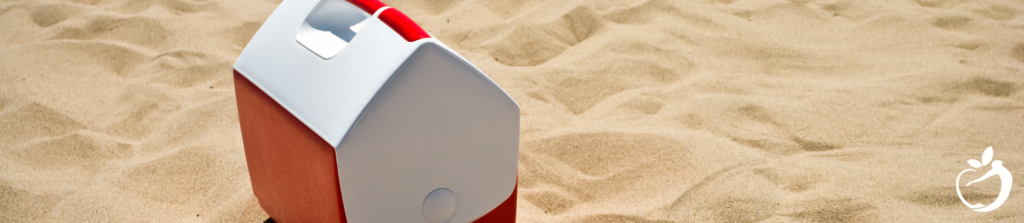 Image of a cooler on a beach, tips for eating healthy on the road: pack a cooler.
