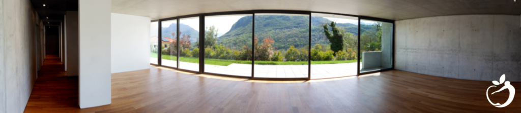 interior of a home with hardwood floors and large sliding glass doors