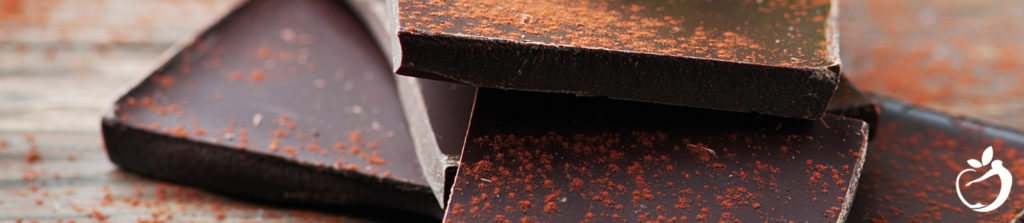 Healthy Valentine’s Day: What To Eat. Image of Dark Chocolate sprinkled with cocao powder..