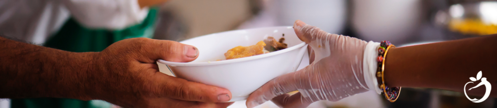 a person handing a bowl of food to another person