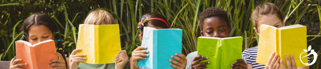 children reading books outside