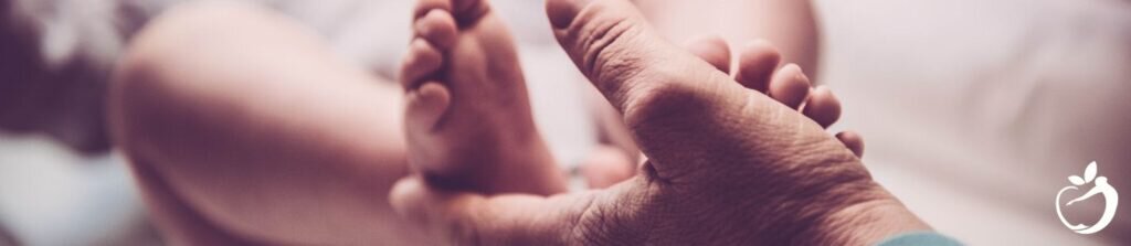 parent touching their child's feet