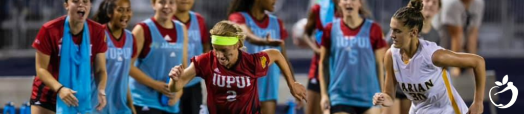 Dr. Scott, and Ellen Antoine's daughter Emma, playing college soccer