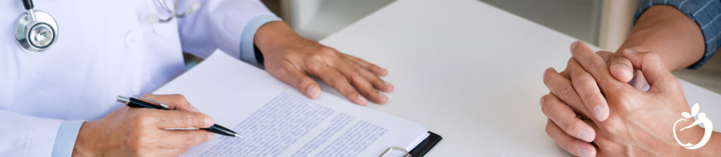 doctor going over information with a patient model