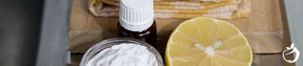 Showing an image of citrus, essential oil, and baking soda, as it relates to natural cleaning recipes ingredients.