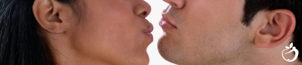 a man and woman about to kiss