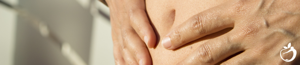 woman with her hands on her stomach