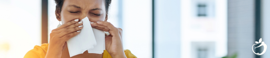 woman blowing her nose