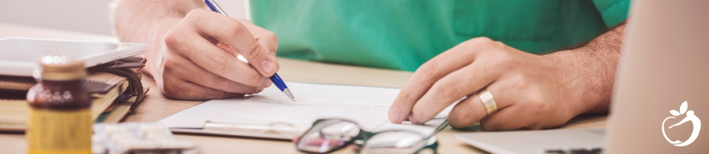 doctor writing notes for patient