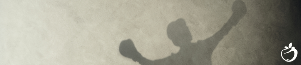 shadow image of person with boxing gloves on