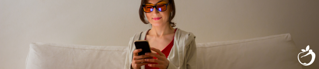 woman wearing blue light blocking glasses