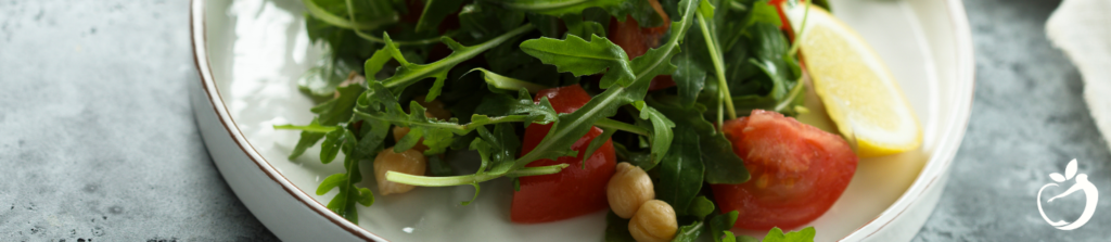 salad with chickpeas and sliced tomato on a plate