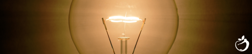 closeup of a lit lightbulb filament