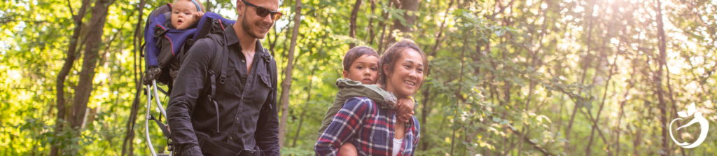 family hiking through the woods