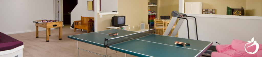 a home gameroom with ping pong and fooseball