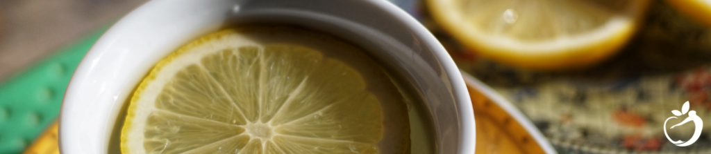 a slice of lemon in a mug of water