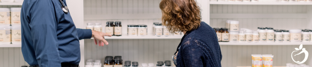 Dr. Scott looking at supplements with a patient