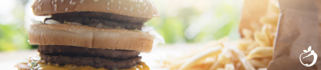 a large burger with a side of fries