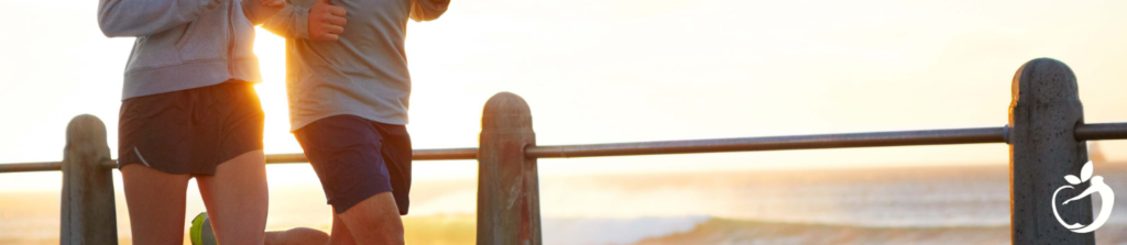 two people jogging at sunrise