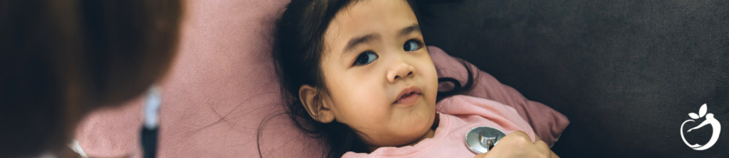 a doctor seeing a child