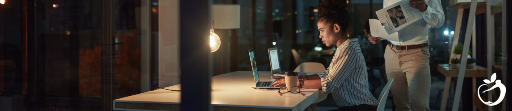 woman working on her laptop at night