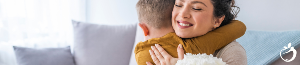 a happy mother, hugging her son